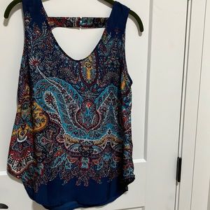 Silky dress tank with two button enclosure in back. Vibrant Indian print.